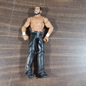 WWE Action Figure with Black Pants and Brown Skin Tone